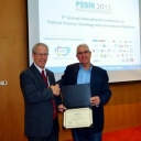 Prof. the Hon. Dr. Stephen Martin, chair of the Board of Governors of the Global Science & Technology Forum, which organized the conference, presented the award to Dr. Rosenberg, who accepted on behalf of his co-authors.